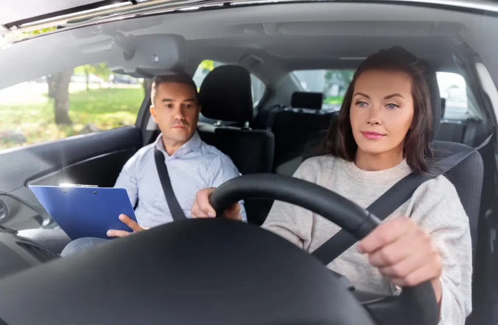 A student taking a driving lesson in Newcastle-under-Lyme with a professional instructor.